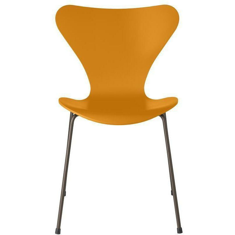 Fritz Hansen Serie 7 -stol lackerad bränd gul skald, brun brons ben
